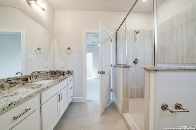 8119 Ventura Blvd, Selma, TX 78154 - bathroom featuring vanity, walk in shower, tile patterned flooring, a ceiling fan, and baseboards