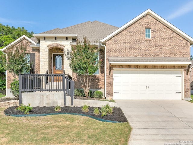 29014 Gooseberry, San Antonio, TX 78260 - view of front of home with concrete driveway, brick siding, a front lawn, and an attached garage