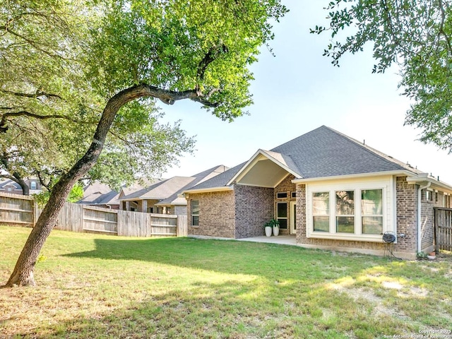 29014 Gooseberry, San Antonio, TX 78260 - back of house featuring brick siding, roof with shingles, and a patio area