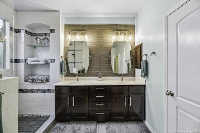 18131 Muir Glen Dr, San Antonio, TX 78257 - full bath featuring double vanity, a walk in shower, and decorative backsplash