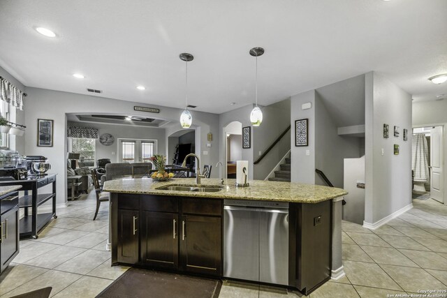 18131 Muir Glen Dr, San Antonio, TX 78257 - kitchen with stainless steel dishwasher, a sink, light tile patterned floors, open floor plan, and recessed lighting