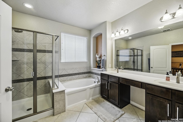 18131 Muir Glen Dr, San Antonio, TX 78257 - full bathroom featuring tile patterned flooring, a bath, a stall shower, and double vanity
