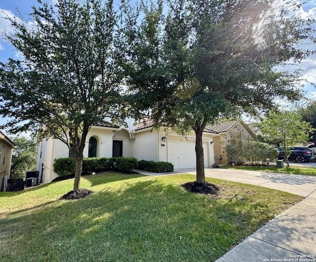 18131 Muir Glen Dr, San Antonio, TX 78257 - view of front of home with concrete driveway, stucco siding, a front lawn, a garage, and a tiled roof