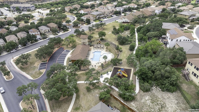 18131 Muir Glen Dr, San Antonio, TX 78257 - aerial view of property's location with a pool and nearby suburban area