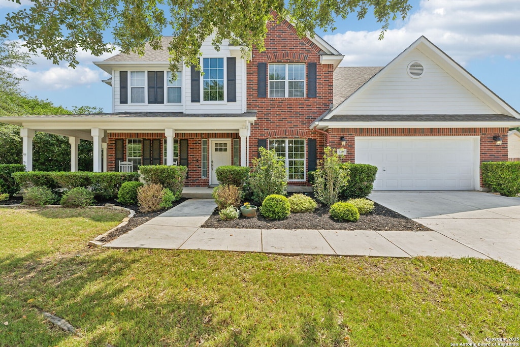 3331 Ashleys Way, Marion, TX 78124 - traditional-style house featuring brick siding, a garage, and a front yard