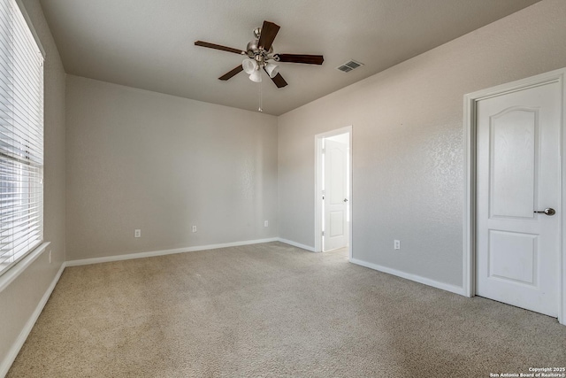 1023 Sundance Fall, San Antonio, TX 78245 - empty room with carpet flooring, a ceiling fan, and baseboards