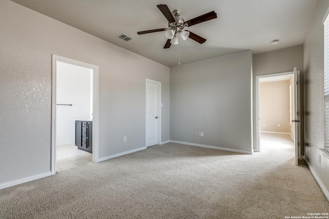 1023 Sundance Fall, San Antonio, TX 78245 - unfurnished bedroom featuring light carpet, baseboards, and ensuite bathroom