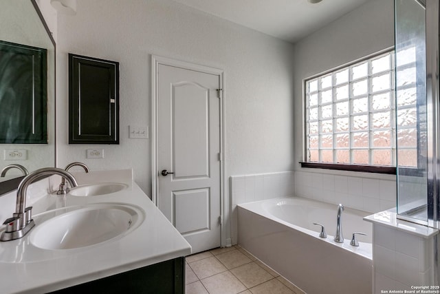 1023 Sundance Fall, San Antonio, TX 78245 - full bath featuring double vanity, tile patterned floors, and a garden tub