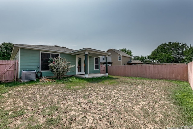 1023 Sundance Fall, San Antonio, TX 78245 - back of house featuring central AC unit, a fenced backyard, and a patio