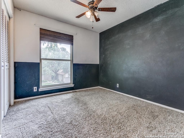 2922 Low Oak St, San Antonio, TX 78232 - spare room with ceiling fan, carpet flooring, baseboards, and a textured ceiling