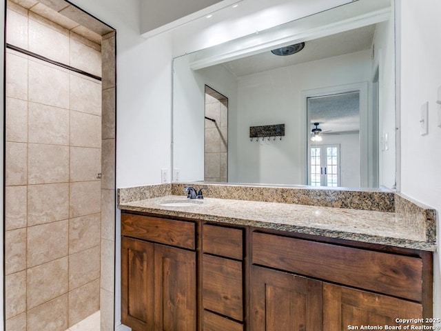 2922 Low Oak St, San Antonio, TX 78232 - bathroom featuring vanity, a tile shower, and ceiling fan