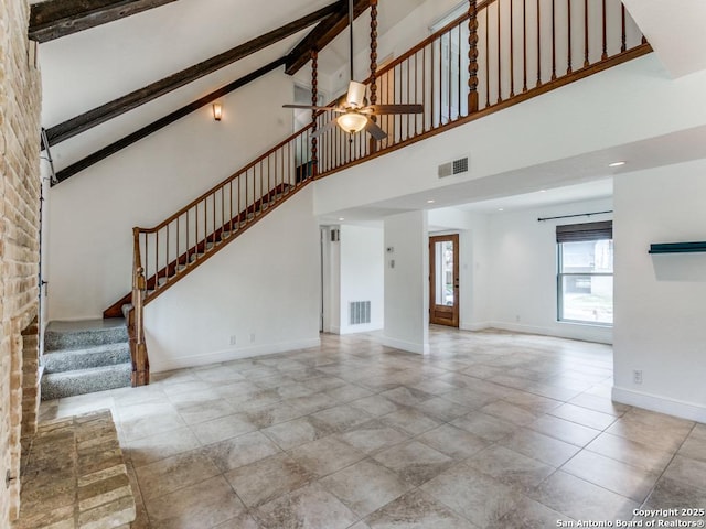 2922 Low Oak St, San Antonio, TX 78232 - unfurnished living room featuring ceiling fan, high vaulted ceiling, stairs, baseboards, and beamed ceiling