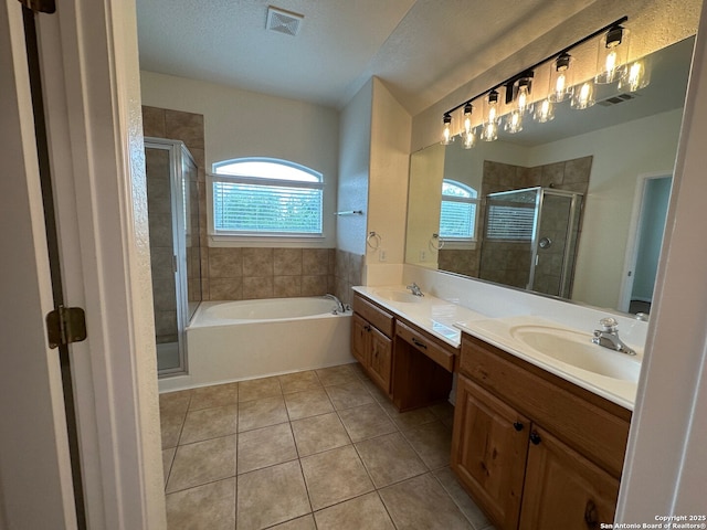 520 Ginsberg, Schertz, TX 78154 - bathroom featuring tile patterned flooring, a shower stall, double vanity, and a garden tub