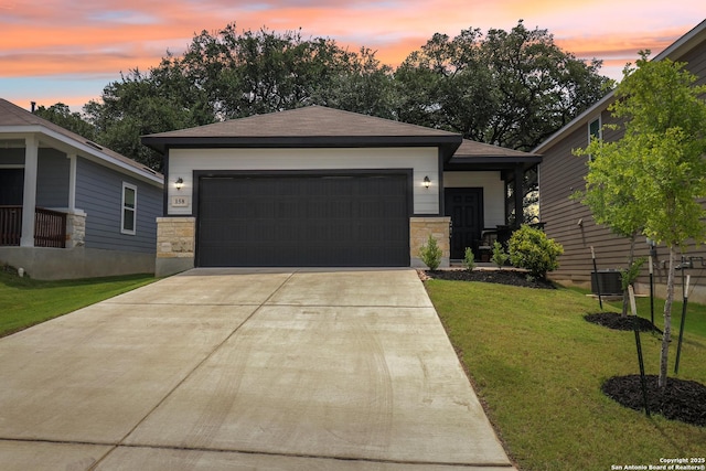 158 Canopy Oak, New Braunfels, TX 78130 - view of front of home featuring a front lawn, driveway, an attached garage, and stone siding
