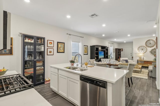 158 Canopy Oak, New Braunfels, TX 78130 - kitchen featuring stainless steel dishwasher, a sink, wood tiled floors, white cabinets, and light countertops