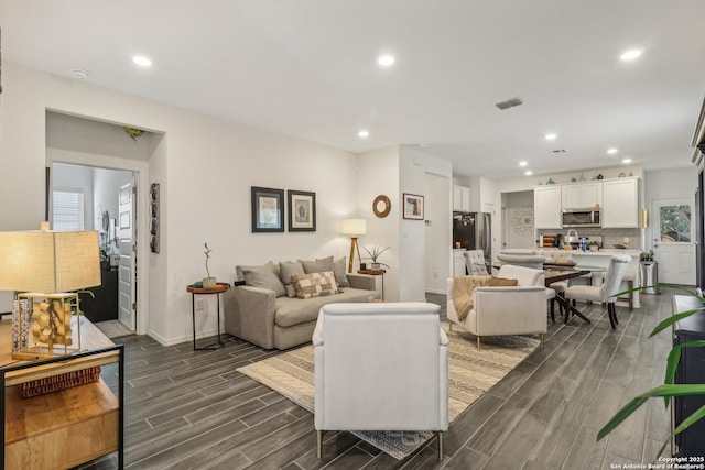 158 Canopy Oak, New Braunfels, TX 78130 - living area featuring dark wood-type flooring, recessed lighting, and baseboards