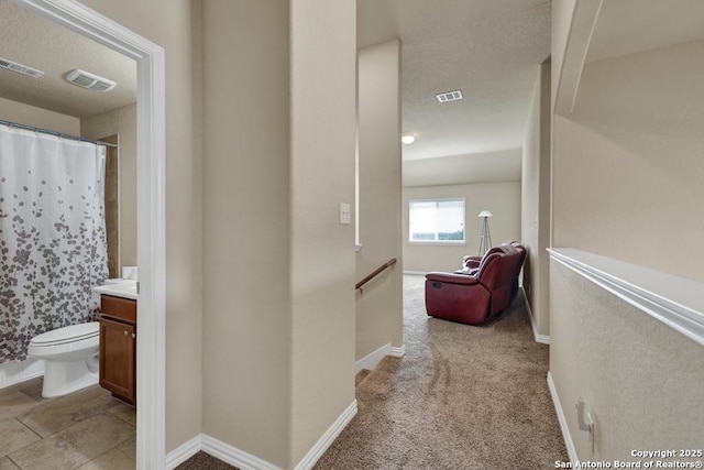 1902 Kalli Jo, New Braunfels, TX 78130 - hallway with an upstairs landing, baseboards, and a textured ceiling