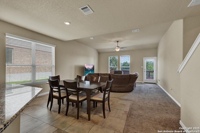 1902 Kalli Jo, New Braunfels, TX 78130 - dining area with a textured ceiling, baseboards, ceiling fan, light tile patterned floors, and light carpet