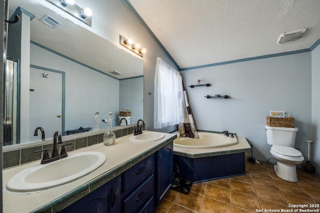 22337 Red Sand, San Antonio, TX 78264 - bathroom featuring vaulted ceiling, a bath, double vanity, a textured ceiling, and ornamental molding