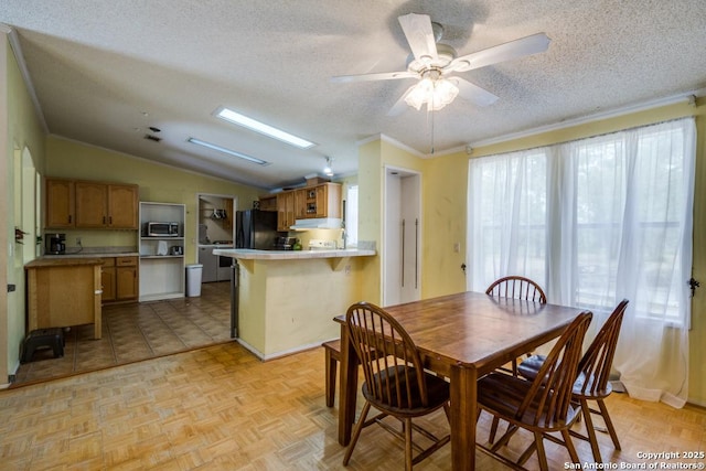 22337 Red Sand, San Antonio, TX 78264 - dining area featuring lofted ceiling, ornamental molding, a textured ceiling, and ceiling fan