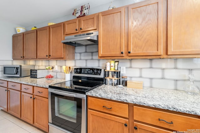 11807 Amber Tree, San Antonio, TX 78254 - kitchen featuring appliances with stainless steel finishes, under cabinet range hood, and light stone countertops