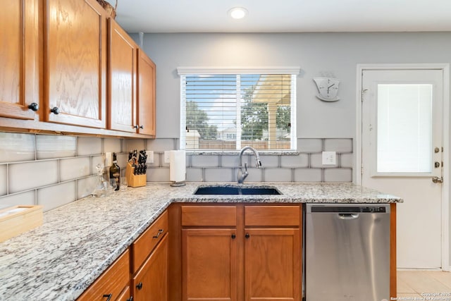 11807 Amber Tree, San Antonio, TX 78254 - kitchen with stainless steel dishwasher, a sink, light stone countertops, brown cabinets, and recessed lighting