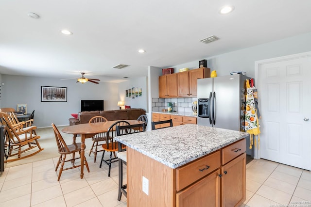 11807 Amber Tree, San Antonio, TX 78254 - kitchen with ceiling fan, a center island, light tile patterned floors, recessed lighting, and decorative backsplash