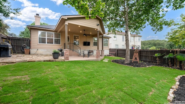 21627 Rio Comal, San Antonio, TX 78259 - rear view of property featuring ceiling fan, a patio area, and a chimney