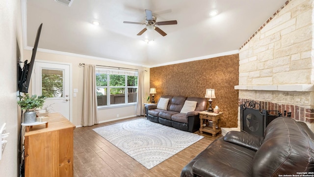 21627 Rio Comal, San Antonio, TX 78259 - living room with vaulted ceiling, a ceiling fan, ornamental molding, wood finished floors, and a large fireplace