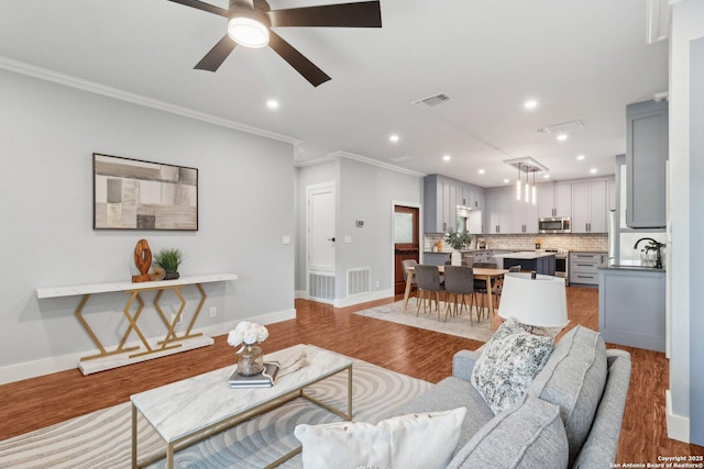 3902 Creek Pt, San Antonio, TX 78230 - living area featuring ornamental molding, recessed lighting, a ceiling fan, baseboards, and wood finished floors