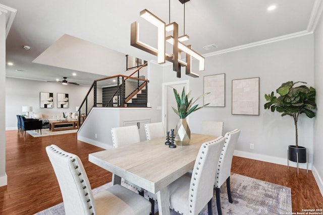 3902 Creek Pt, San Antonio, TX 78230 - dining space with stairs, ornamental molding, recessed lighting, baseboards, and wood finished floors