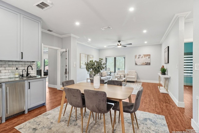 3902 Creek Pt, San Antonio, TX 78230 - dining room with ornamental molding, a ceiling fan, recessed lighting, wood finished floors, and baseboards