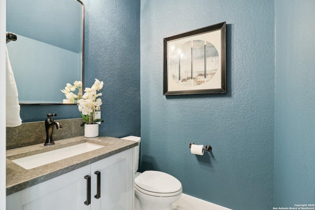 3902 Creek Pt, San Antonio, TX 78230 - half bath featuring vanity, toilet, and a textured wall