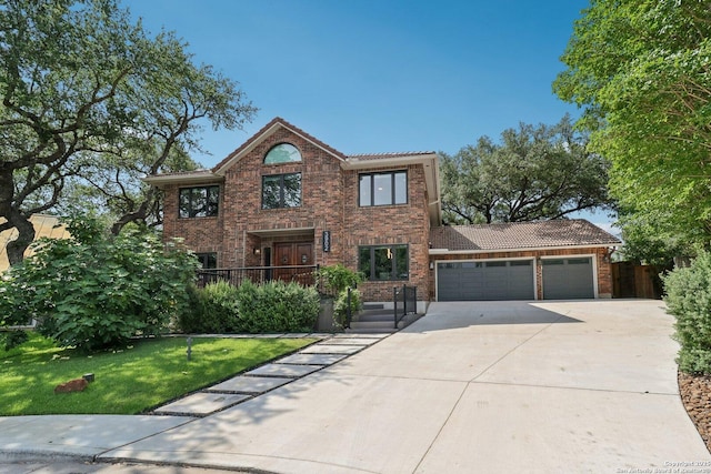 3902 Creek Pt, San Antonio, TX 78230 - traditional-style house with an attached garage, a tile roof, concrete driveway, a front yard, and brick siding