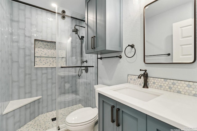 3902 Creek Pt, San Antonio, TX 78230 - bathroom with backsplash, toilet, a stall shower, and vanity