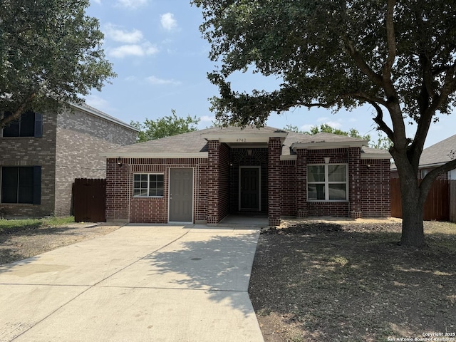 4742 Highland Farm, San Antonio, TX 78244 - view of front of house featuring brick siding, driveway, and a shingled roof