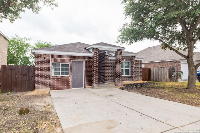 4742 Highland Farm, San Antonio, TX 78244 - view of front of property featuring brick siding, roof with shingles, and a patio area