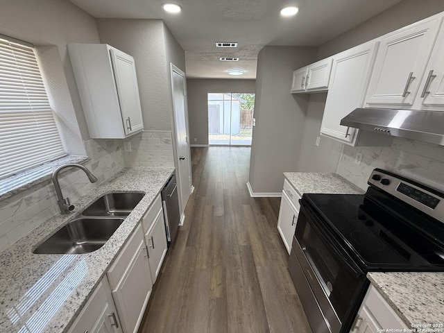4742 Highland Farm, San Antonio, TX 78244 - kitchen with electric range, under cabinet range hood, a sink, backsplash, and light stone counters