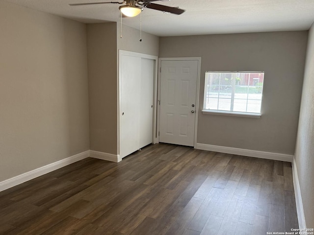 4742 Highland Farm, San Antonio, TX 78244 - unfurnished bedroom with dark wood-type flooring, baseboards, a ceiling fan, and a closet