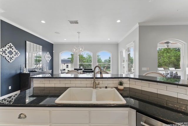 810 Pinnacle, New Braunfels, TX 78132 - kitchen with a sink, white cabinetry, plenty of natural light, recessed lighting, and a chandelier