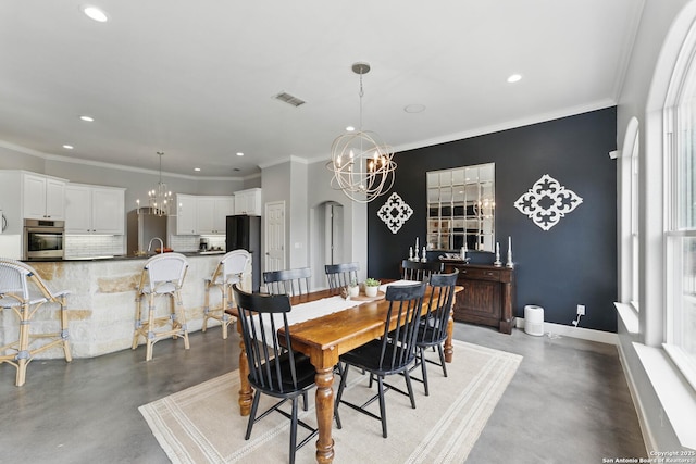 810 Pinnacle, New Braunfels, TX 78132 - dining area featuring finished concrete floors, a chandelier, recessed lighting, ornamental molding, and baseboards
