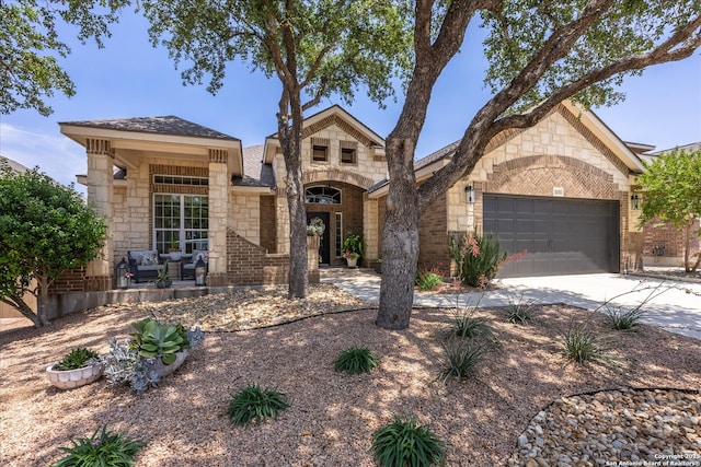 13055 Grove Pt, San Antonio, TX 78253 - view of front facade featuring a garage, driveway, and stone siding