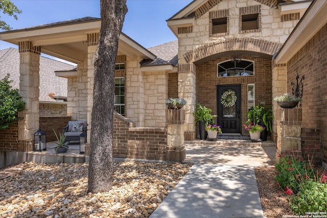 13055 Grove Pt, San Antonio, TX 78253 - property entrance with brick siding, a shingled roof, a porch, and stone siding