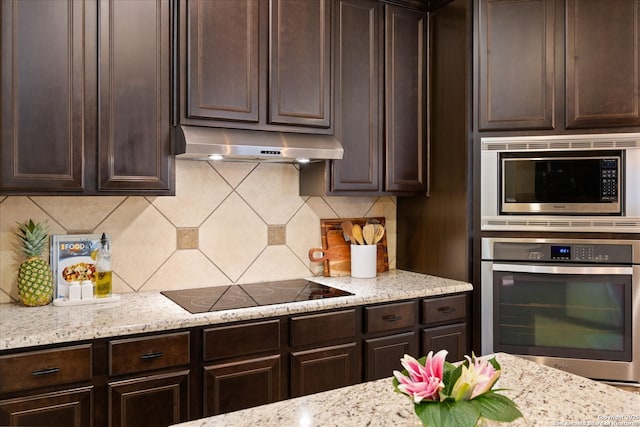 13055 Grove Pt, San Antonio, TX 78253 - kitchen featuring stainless steel appliances, under cabinet range hood, dark brown cabinetry, and backsplash