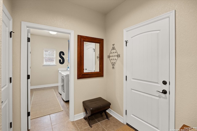 13055 Grove Pt, San Antonio, TX 78253 - laundry room featuring light tile patterned floors, washing machine and dryer, and baseboards