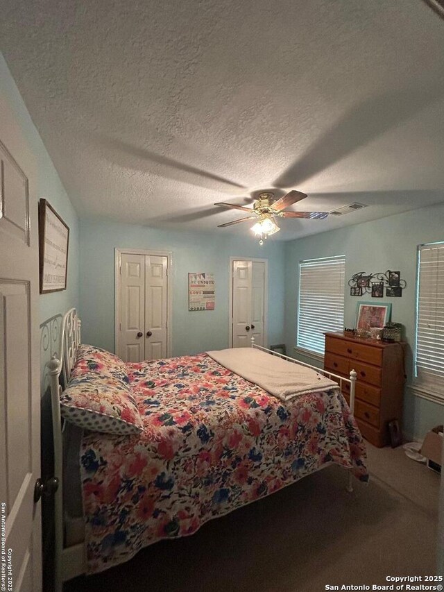 129 W High Line, Trinity, TX 75862 - bedroom with carpet, a textured ceiling, and a ceiling fan