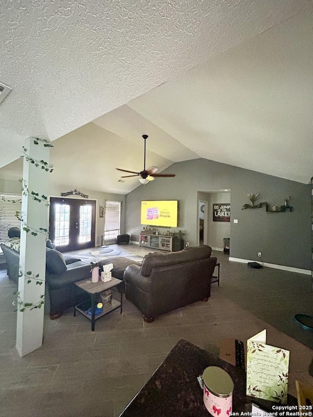 129 W High Line, Trinity, TX 75862 - living room with lofted ceiling, ceiling fan, and a textured ceiling