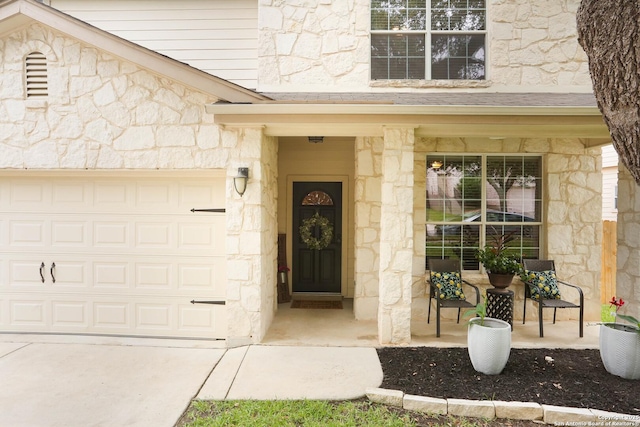 17206 Ashbury, San Antonio, TX 78247 - entrance to property featuring stone siding, a porch, and a garage