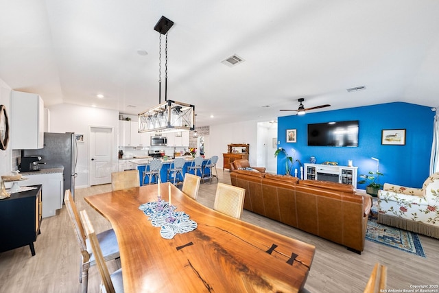 5483 Jasmine, Bulverde, TX 78163 - dining area featuring ceiling fan, lofted ceiling, and a chandelier