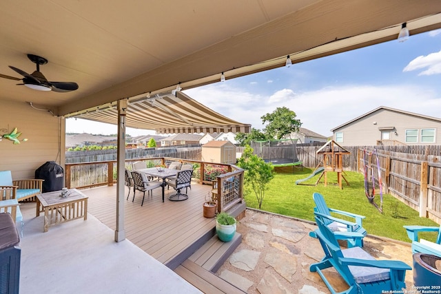 5483 Jasmine, Bulverde, TX 78163 - view of patio with outdoor dining space, a trampoline, a deck, a playground, and area for grilling